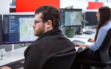 Jess-Luke-working-at-desks-Addinsight